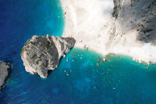 Free Stunning aerial view of ocean cliffs and turquoise waters, highlighting natural coastal beauty. Stock Photo