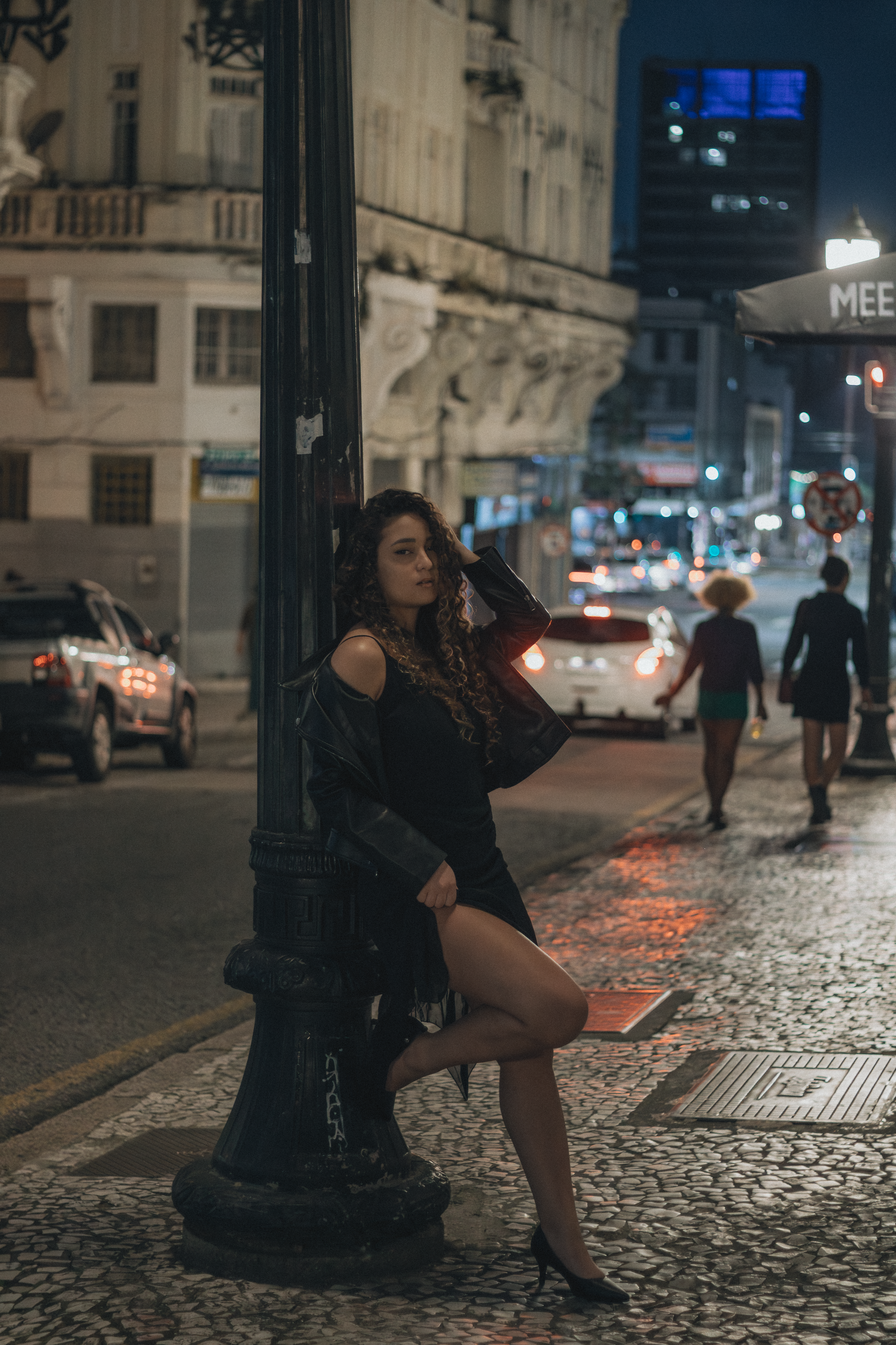 Young Woman Posing At Night on Urban Street · Free Stock Photo