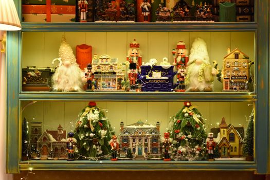 A vibrant shelf display of Christmas figurines and festive decorations.
