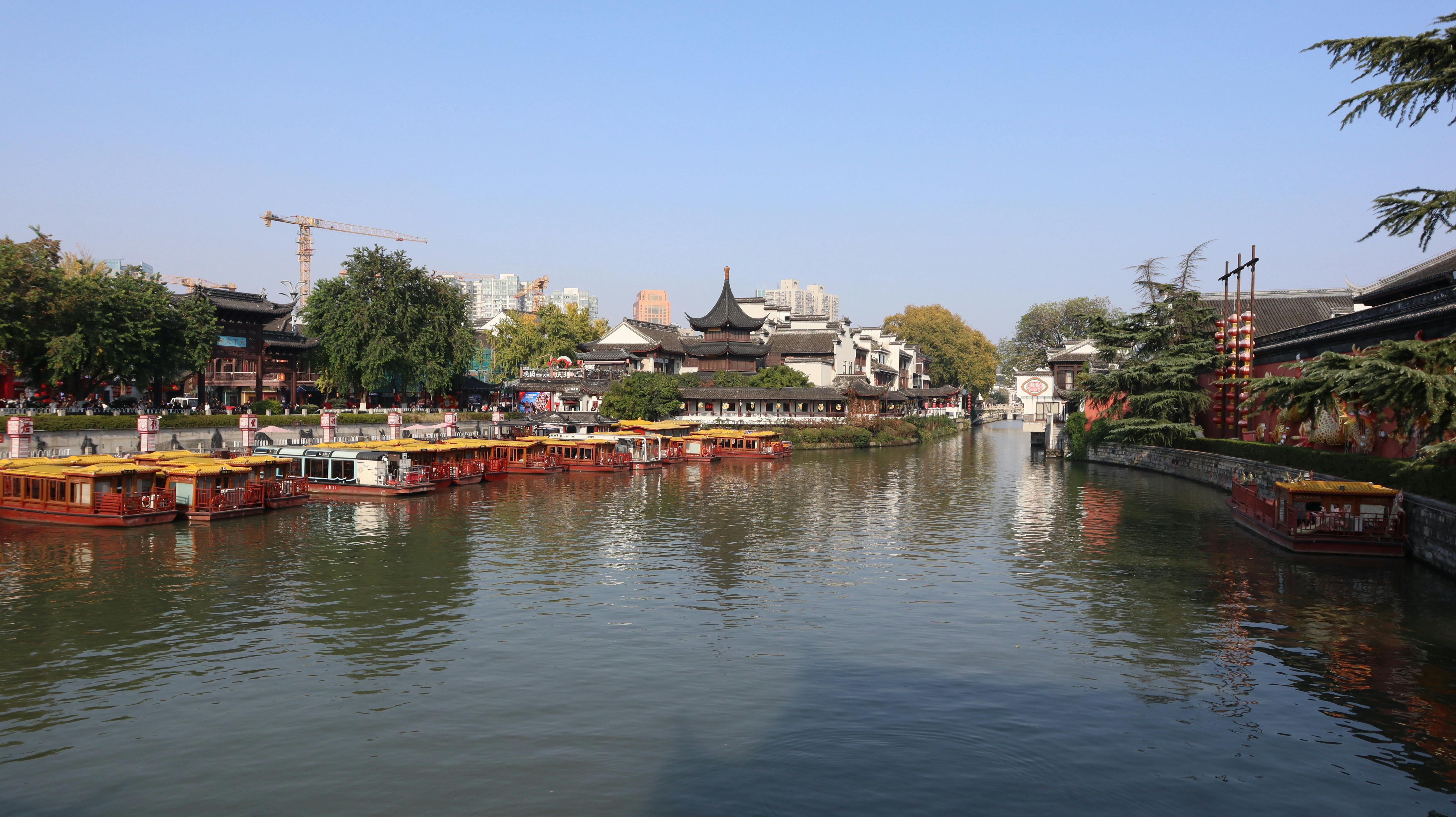 Scenic canal view featuring traditional architecture in Nanjing, China.