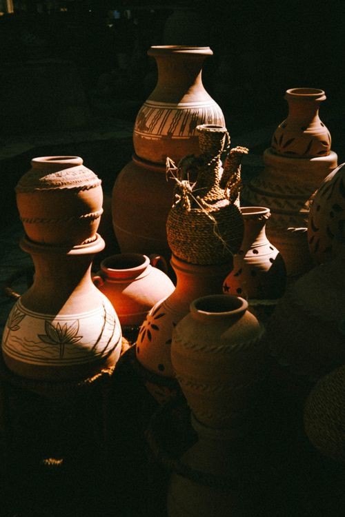 Free Elegant display of traditional Omani pottery captured under warm light, showcasing artistic craftsmanship. Stock Photo