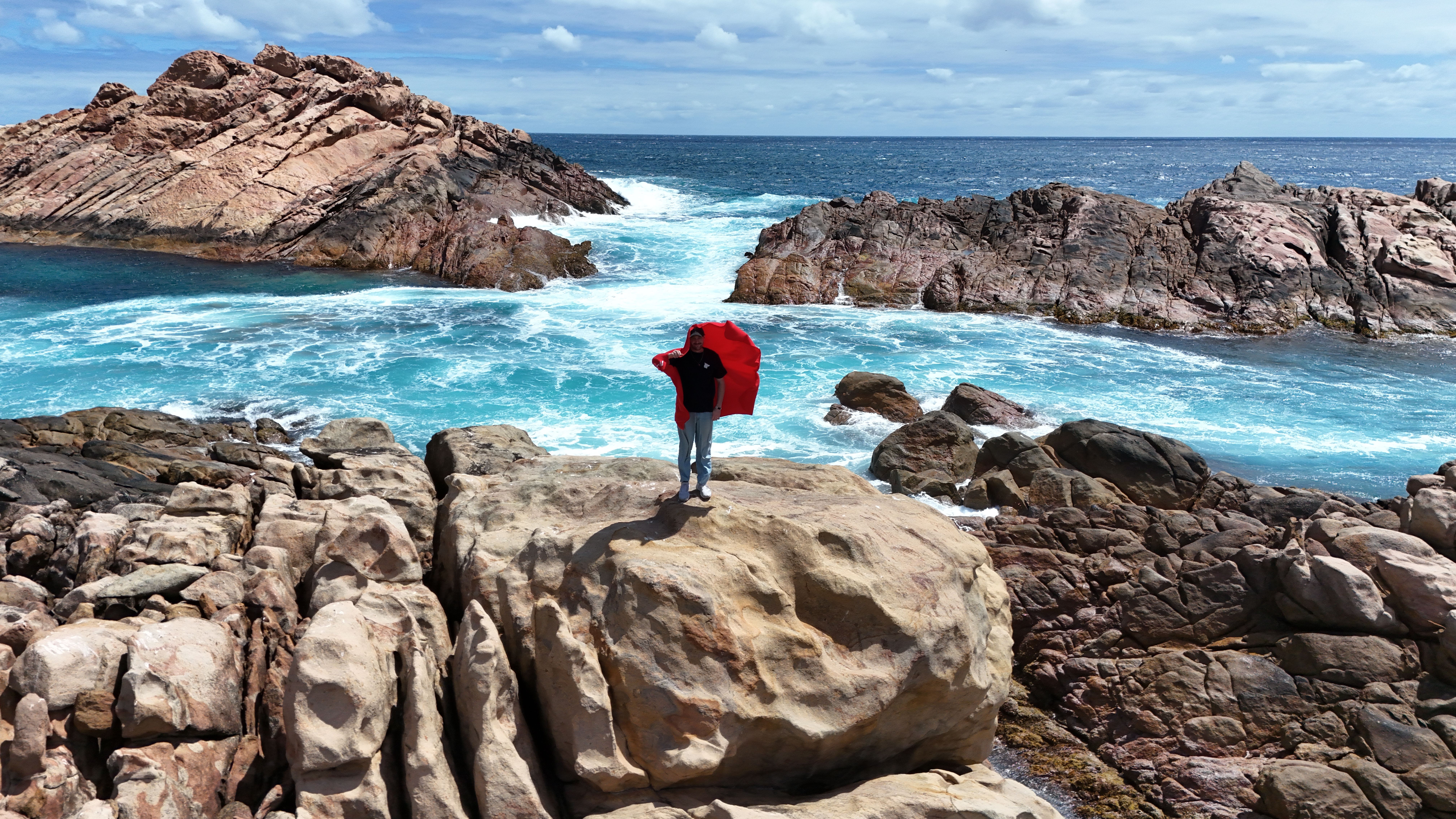 Explore the rugged beauty of Western Australia's coastline, featuring stunning rock formations and vibrant ocean hues.