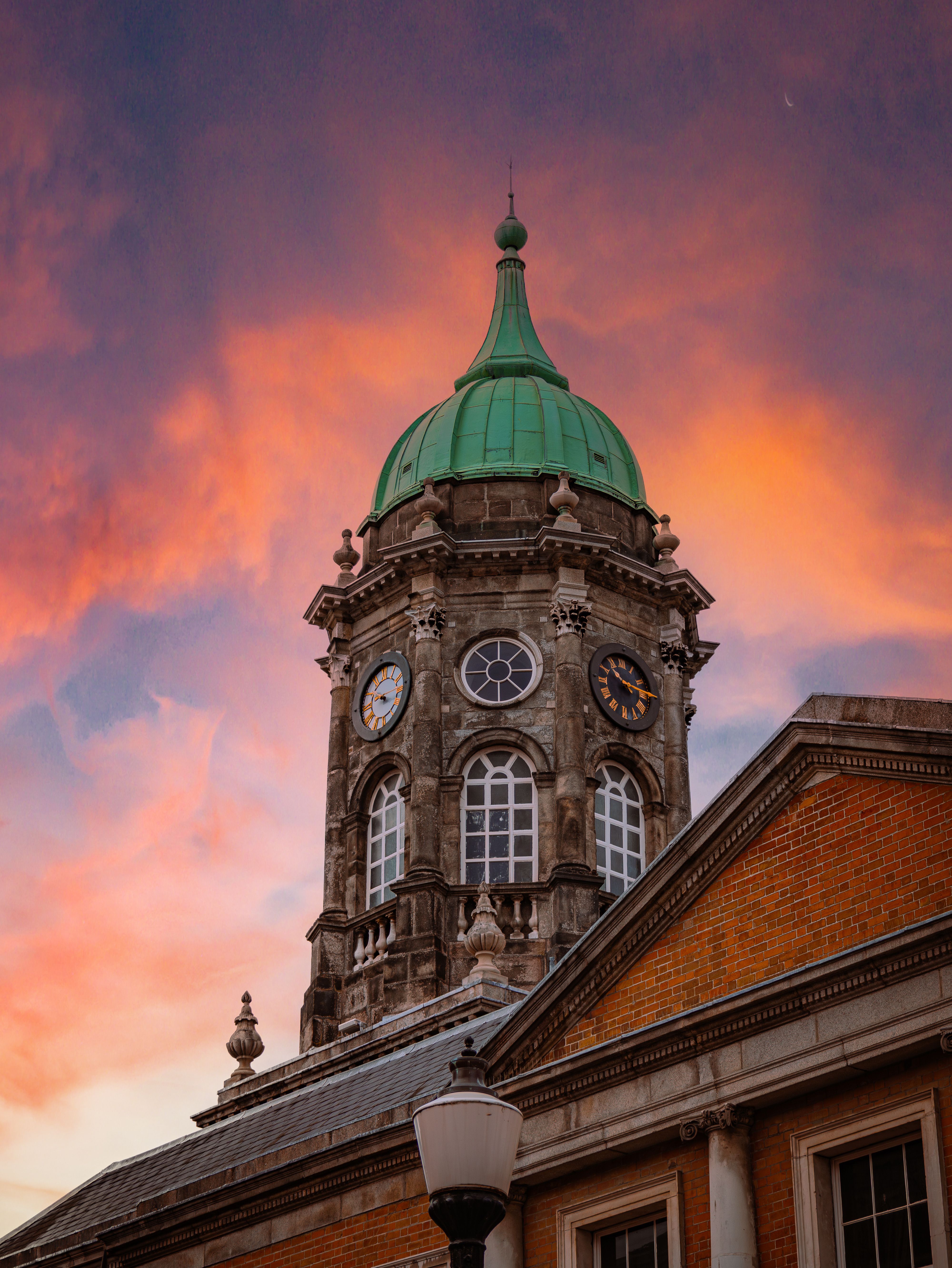 Historic Clock Tower Against Vibrant Evening Sky · Free Stock Photo