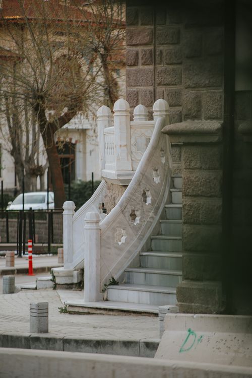 Free A decorative marble staircase curves gracefully in an urban outdoor environment. Stock Photo