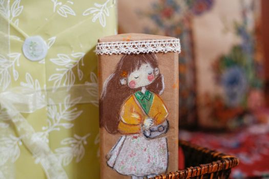 Charming handmade gift wrapped with cute illustrated paper, perfect for special occasions.