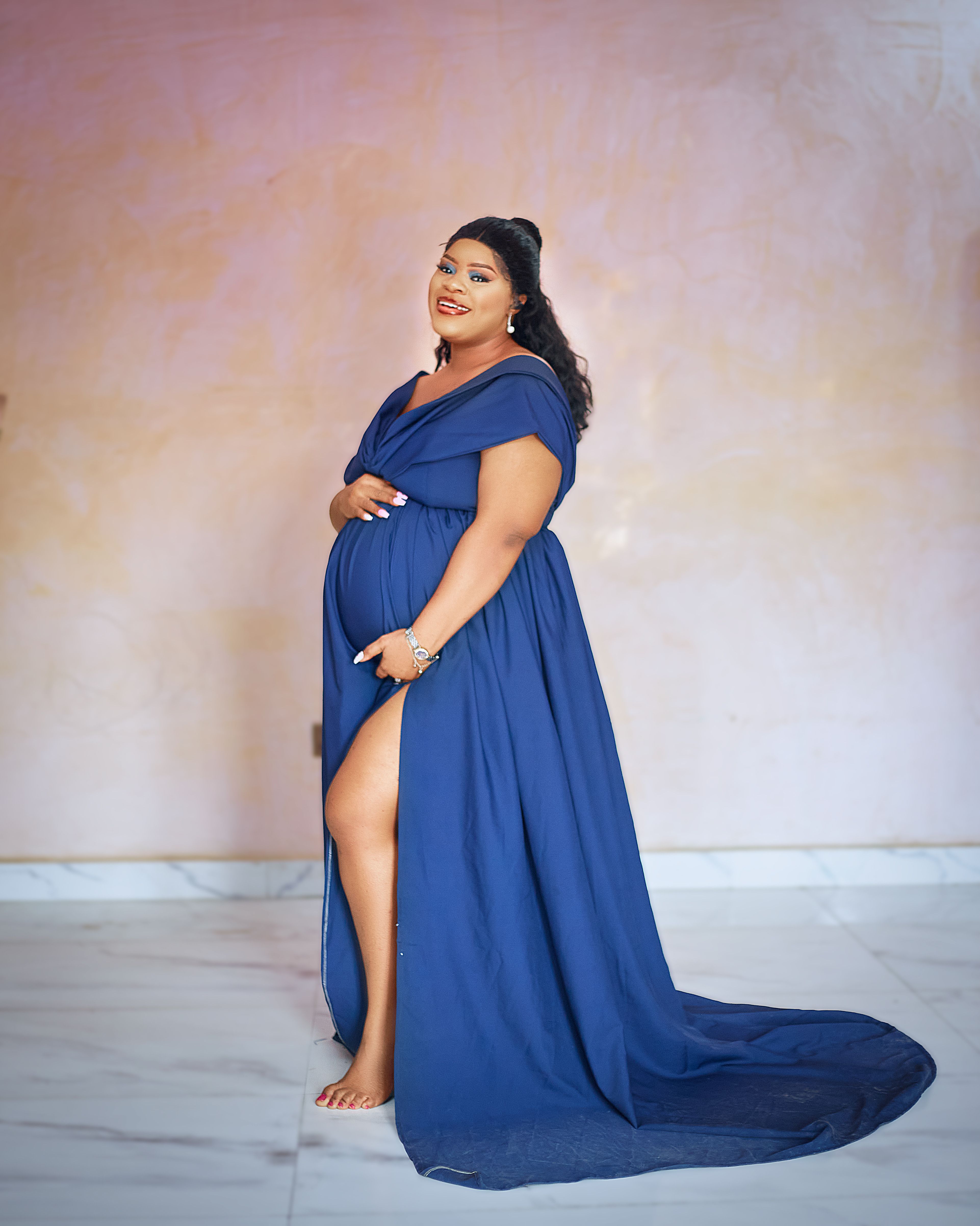 A Pregnant Woman in Blue Floral Dress  Free Stock Photo