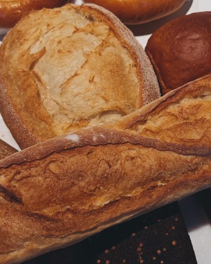 Freshly baked artisan breads — photo by Iryna Varanovich on Pexels