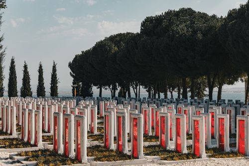 Free Rows of Çanakkale war cemetery monuments under clear skies, honoring sacrifice. Stock Photo