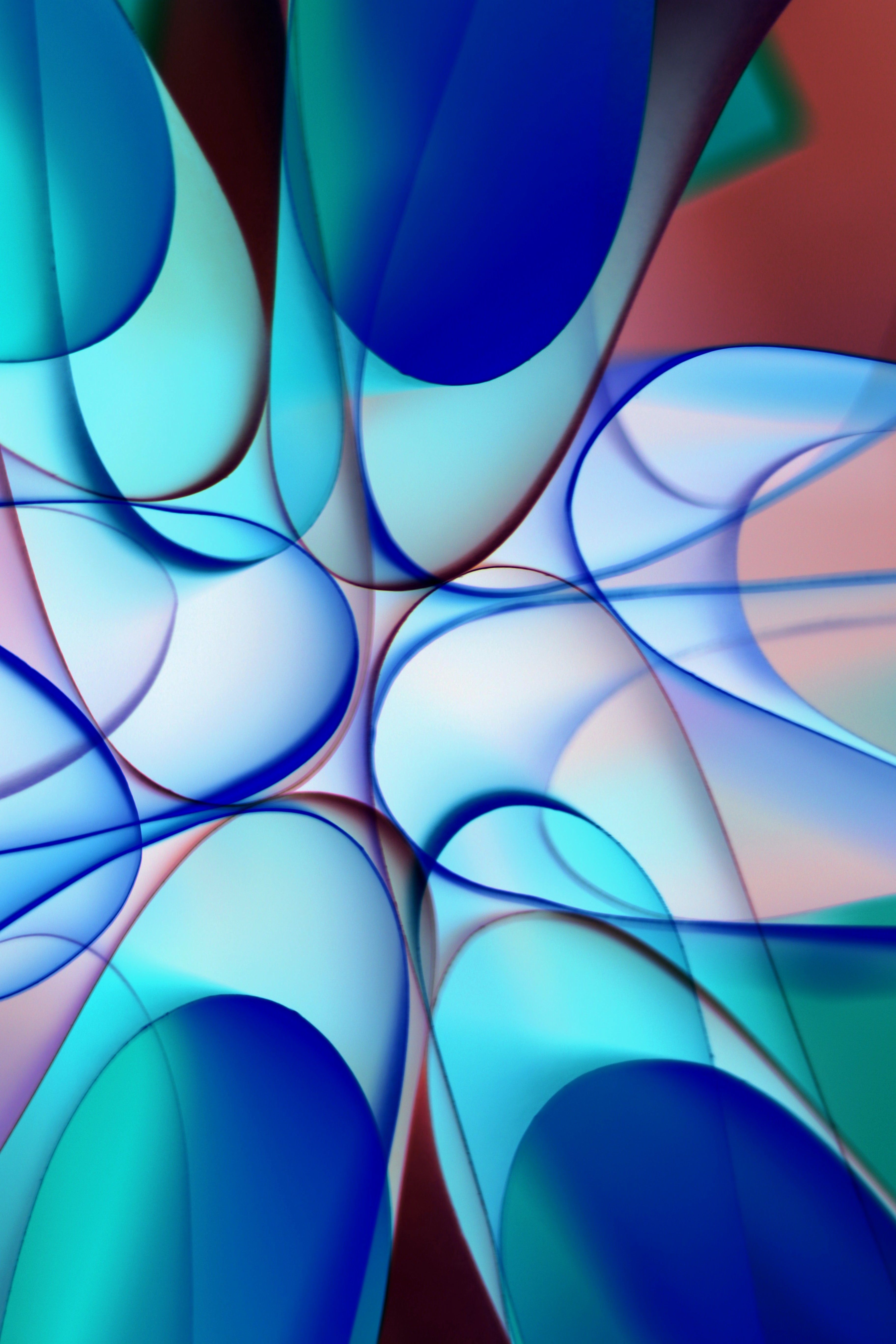 Abstract digital art with swirling blue and aqua waves pattern.