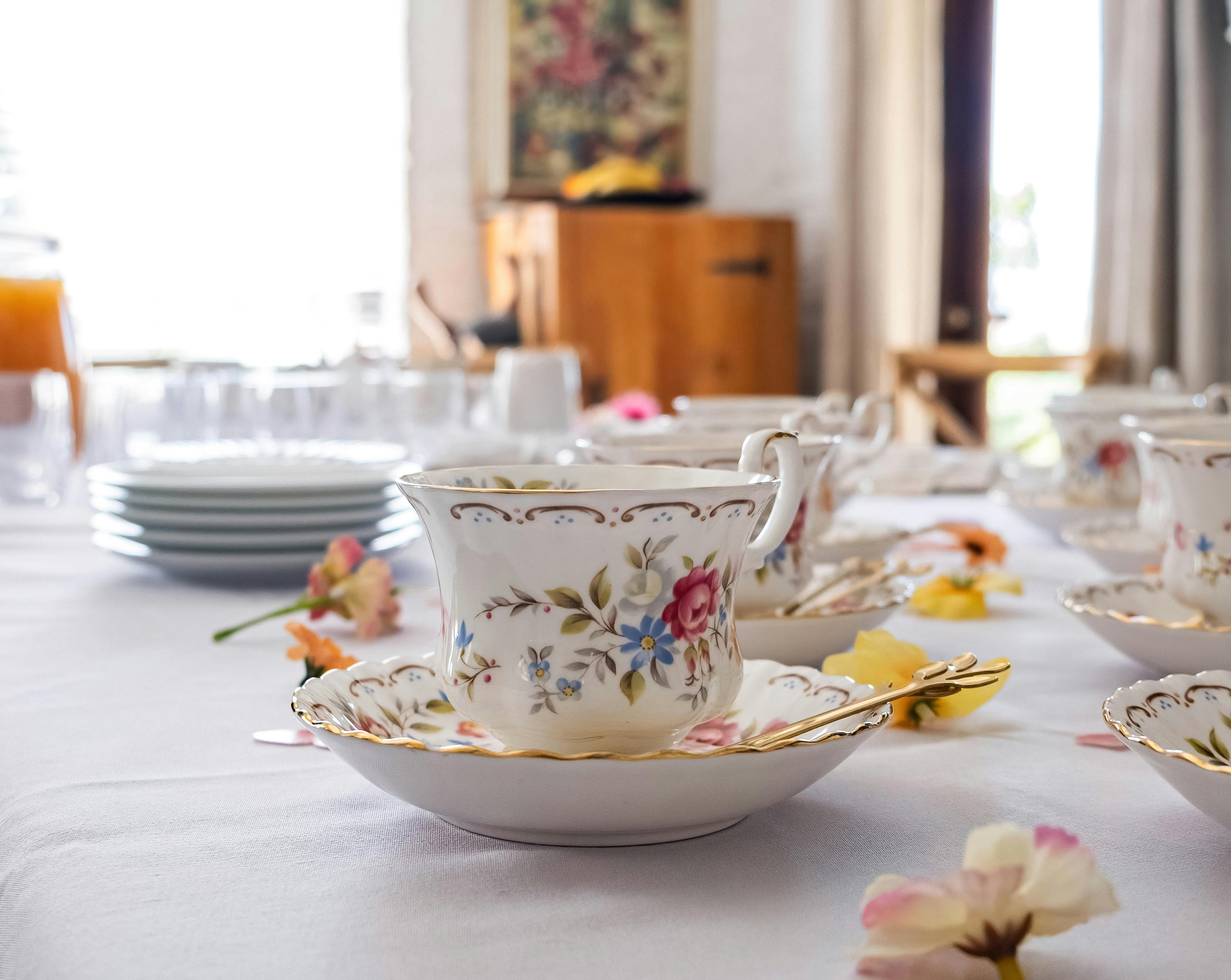 Charming porcelain tea set with floral patterns arranged elegantly on a table.