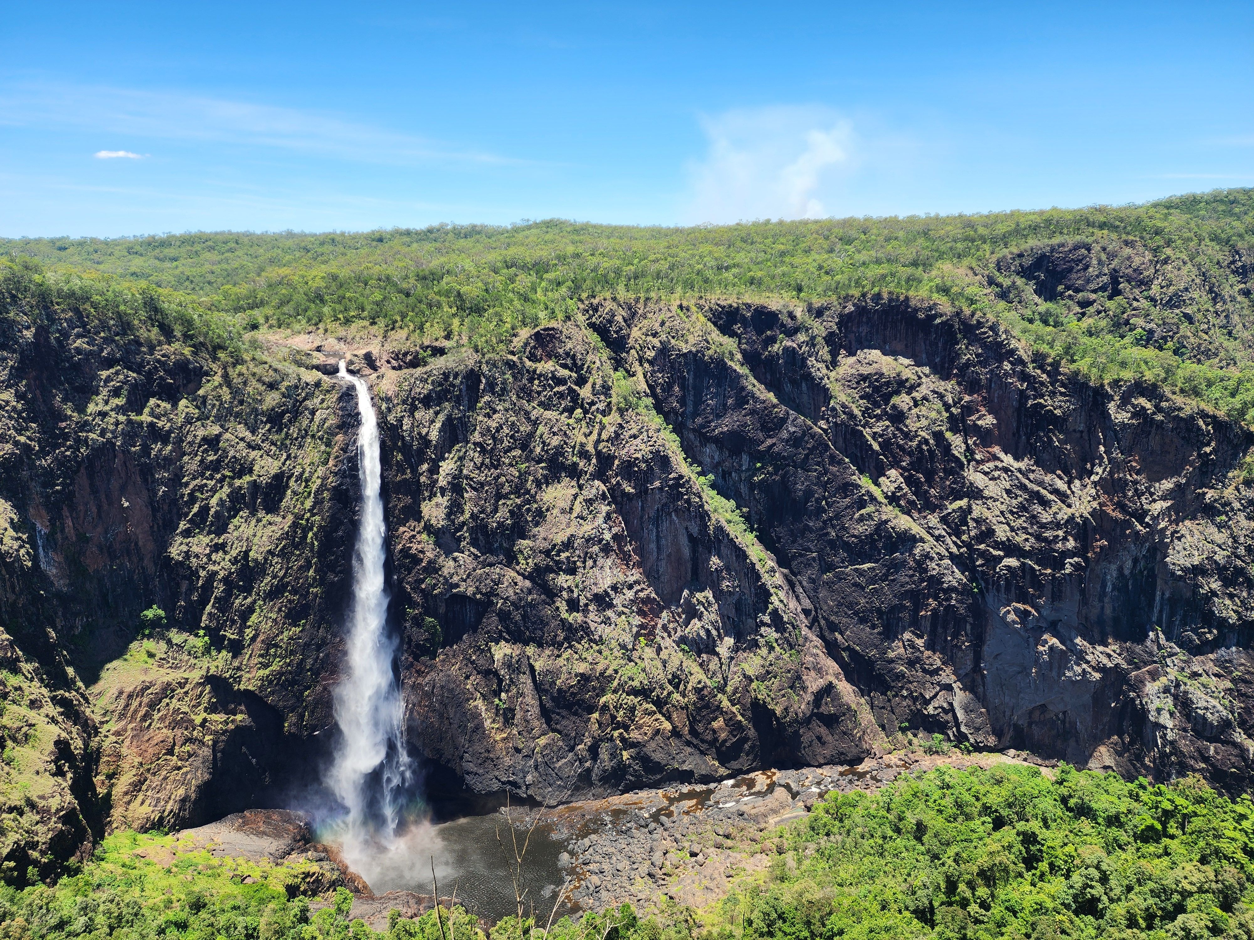 Unbeatable Helicopter Tour Over Victoria Falls Review: The Flight of Angels Experience Review 2026 - Breathtaking aerial view of Wallaman Falls cascading amidst lush greenery in Australia.