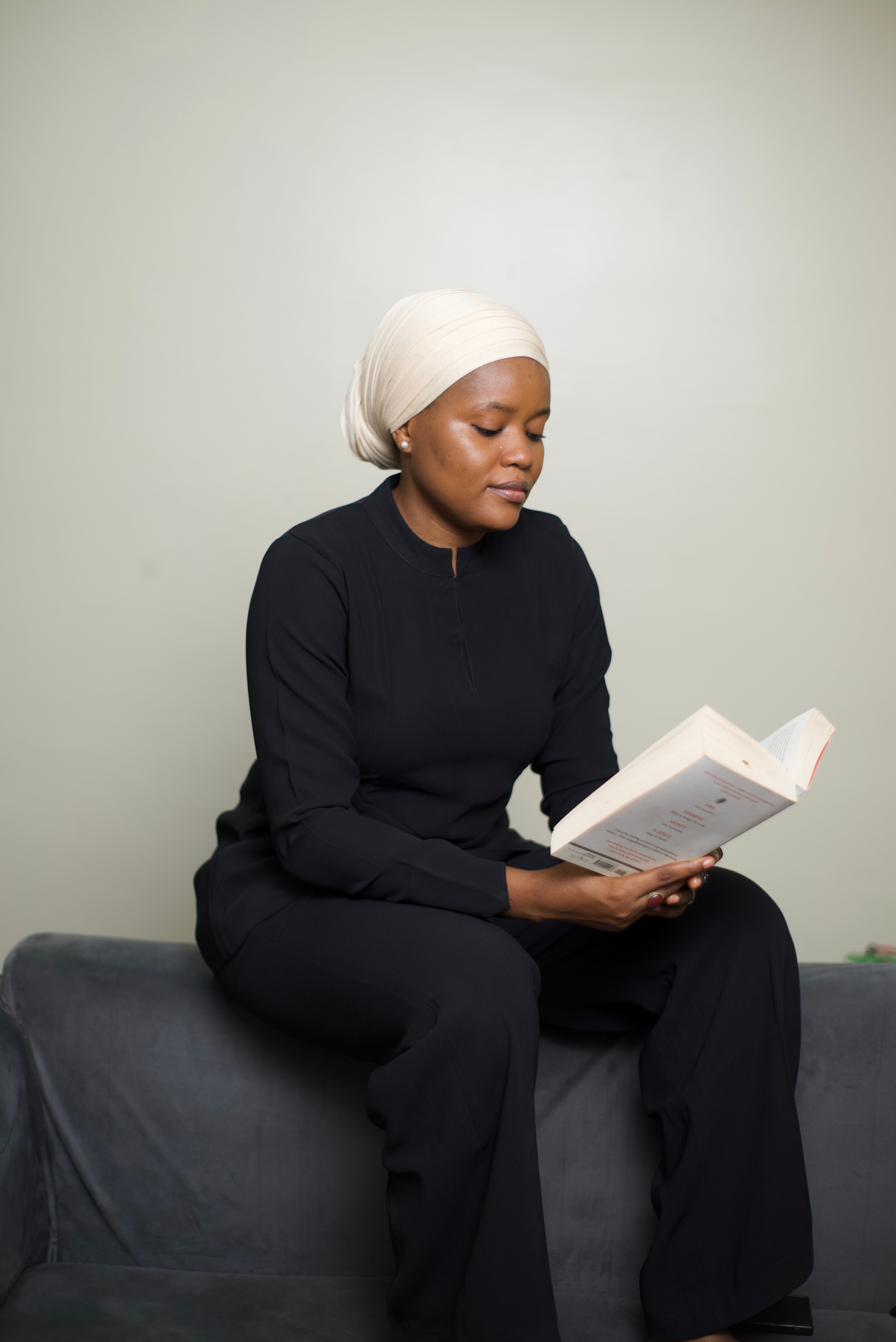 Elegant Woman Reading in Minimalist Indoor Setting · Free Stock Photo