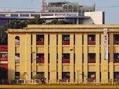 Colorful Urban Building with Banners in Daylight