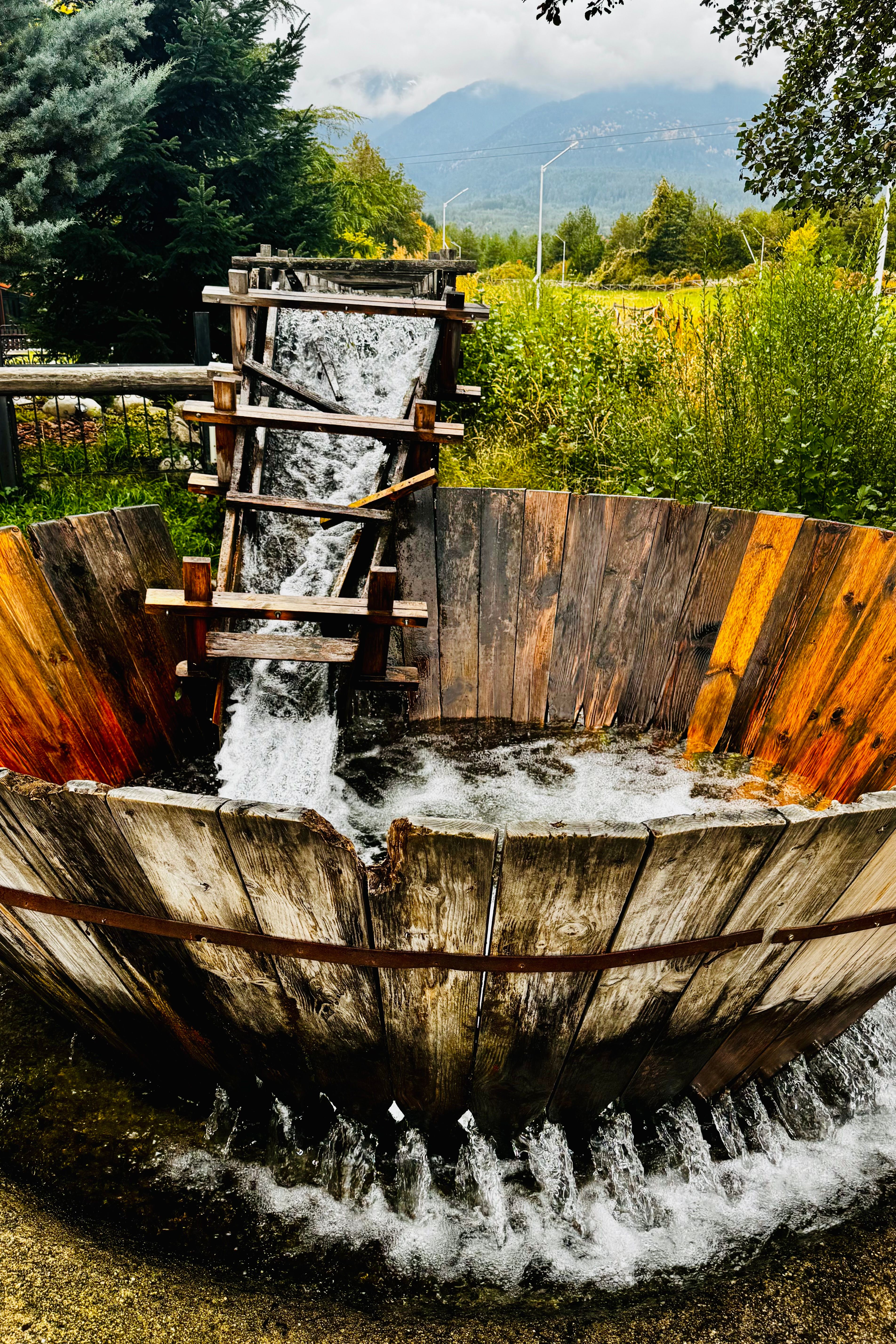Rustic Water Wheel in Lush Green Setting · Free Stock Photo