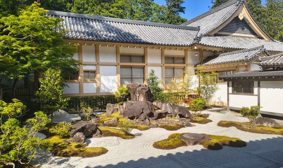 Asymmetrical rock arrangements nestled within a meticulously raked gravel bed Asymmetrical rock arrangements nestled within a meticulously raked gravel bed