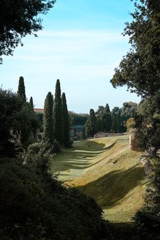 Serene view of the lush, green gardens in ancient Pompei, Campania, Italy.