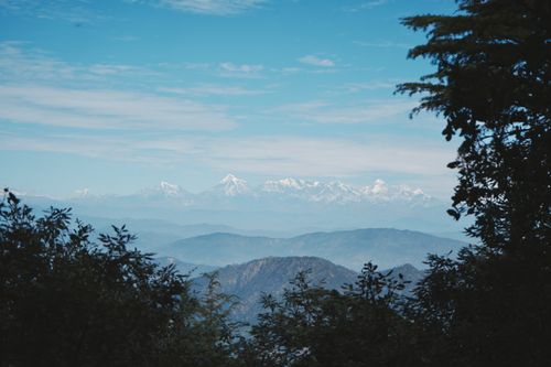 Free Breathtaking landscape featuring the snow-covered peaks of the Himalayas under a clear blue sky. Stock Photo