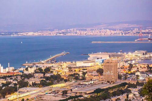 Free A stunning view of Haifa's harbor and cityscape in the evening light. Stock Photo