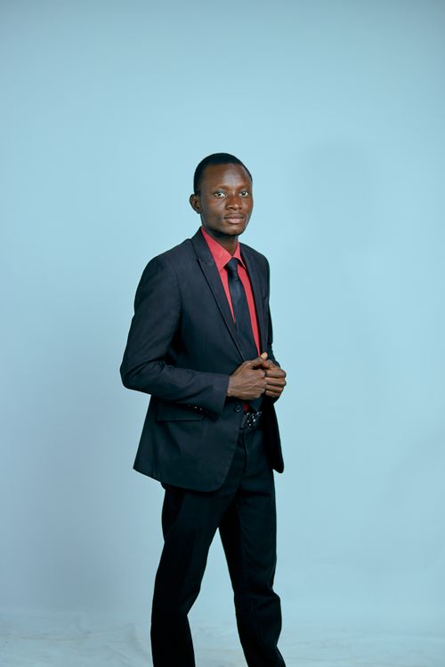 Free Formal portrait of a confident adult businessman in a black suit with a red tie. Stock Photo