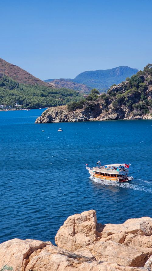Free Explore beautiful landscapes and crystal waters on a boat ride along Türkiye's stunning Turquoise Coast. Stock Photo