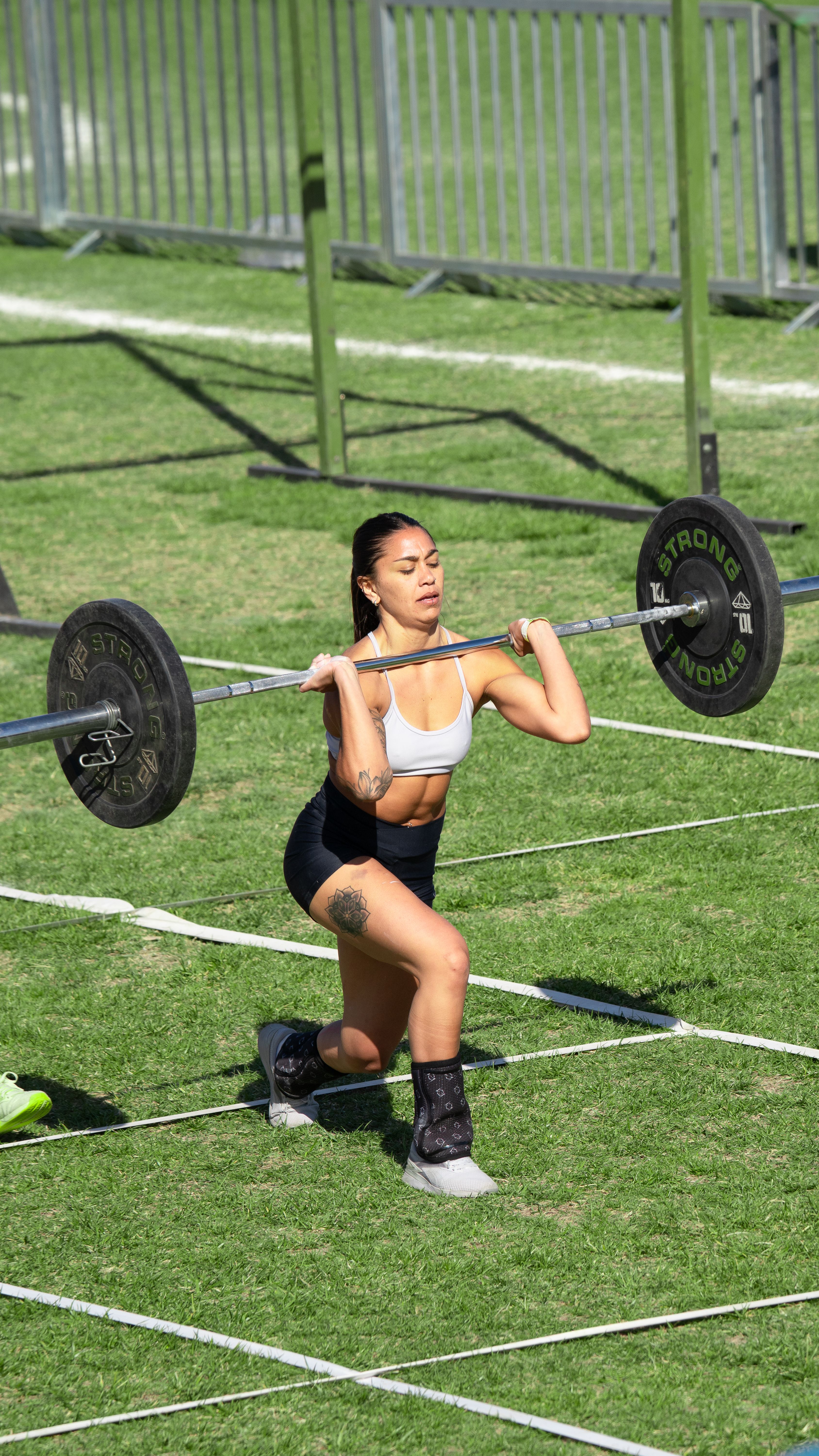 Fitness enthusiasts training at early morning workout session