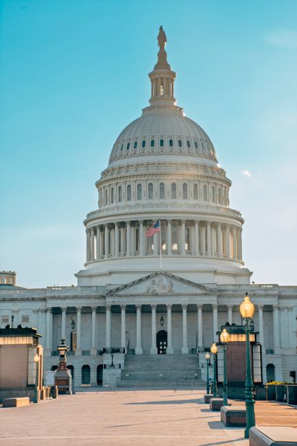 Photo by Gabriel Tovar Stunning view of the United States Capitol building with bright sky, symbolizing American democracy and government.