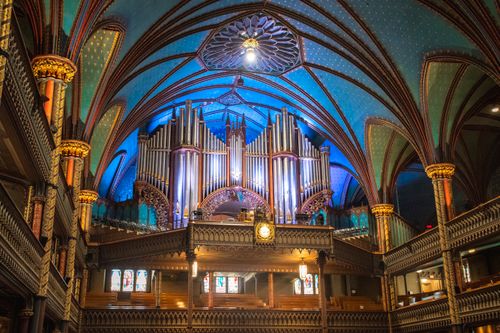 Free Stunning cathedral interior with a grand pipe organ and intricate architectural details. Stock Photo