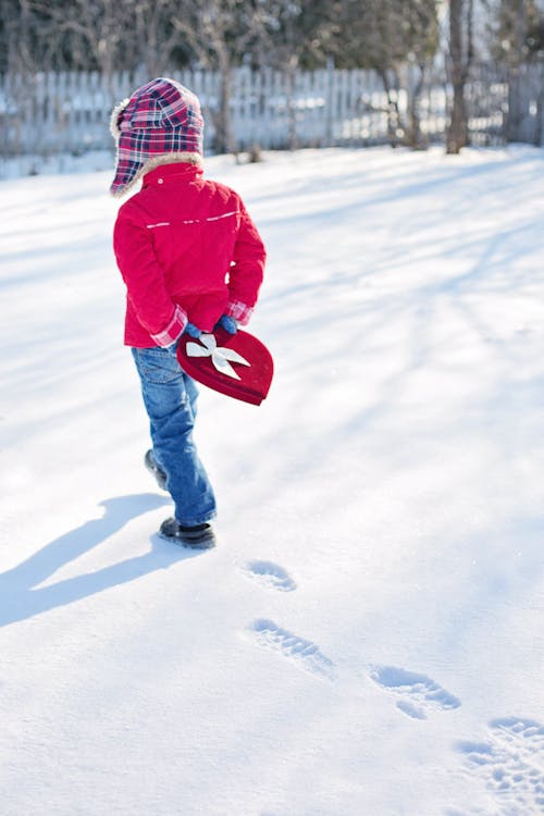 Free Toddler Walks on Snow Stock Photo