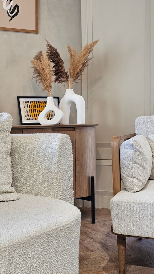 Free A stylish modern living room with minimalist furniture and decor accents. Stock Photo