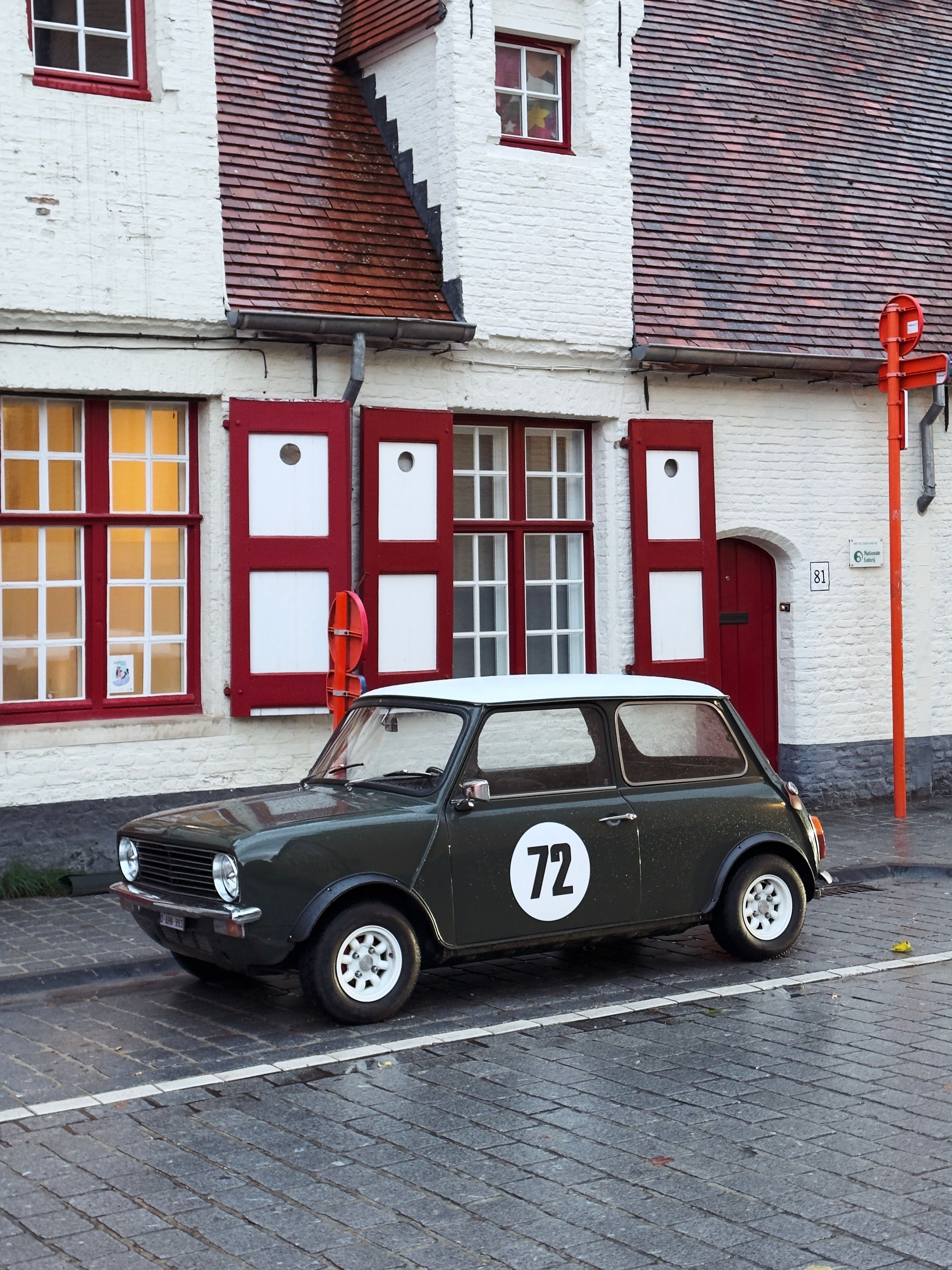 Vintage Mini Cooper Parked in Quaint Belgian Street · Free Stock Photo