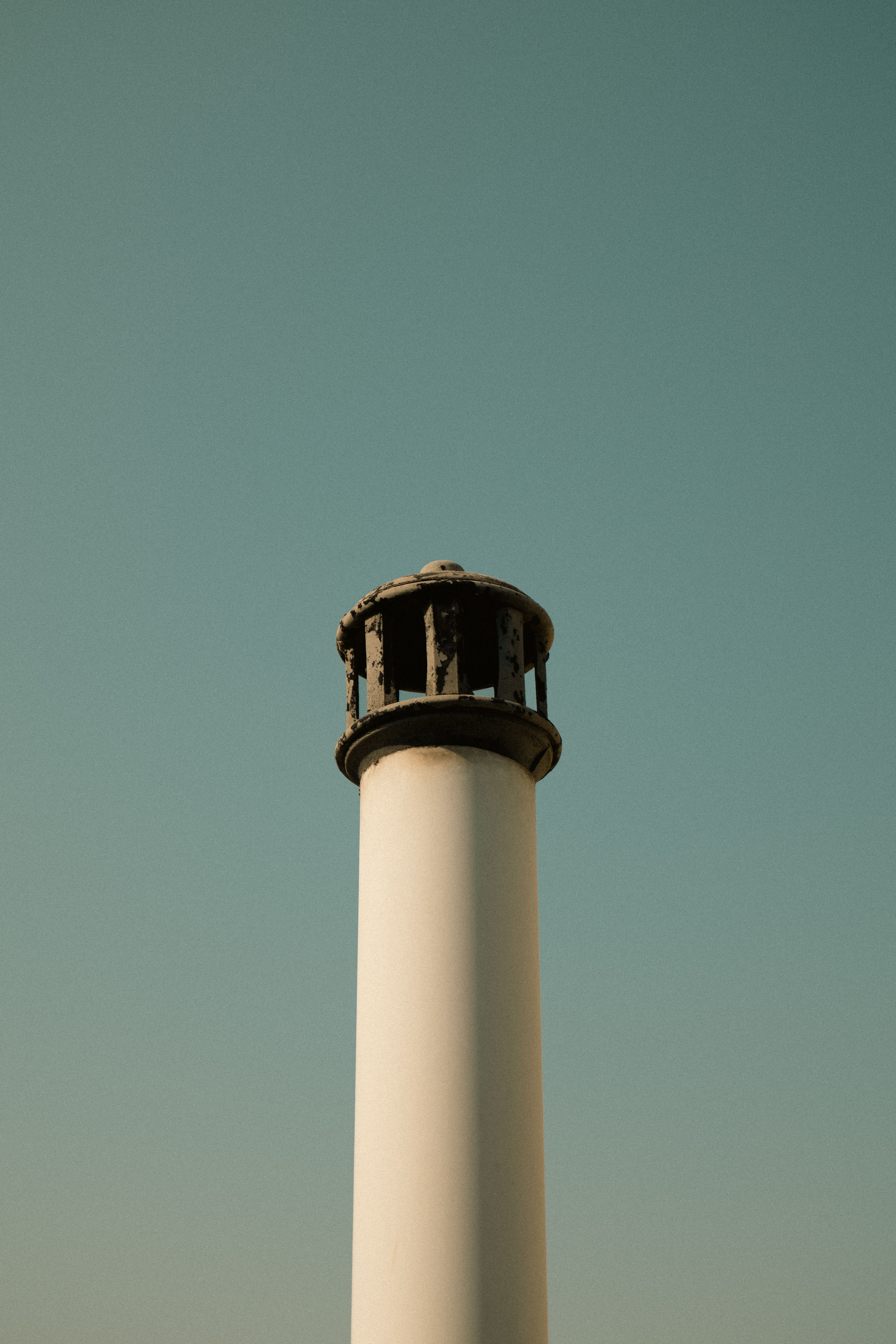 Minimalist Lighthouse Against a Clear Sky · Free Stock Photo