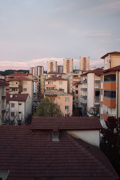 Free Cityscape view of apartment complexes against a twilight sky, showcasing modern urban living. Stock Photo