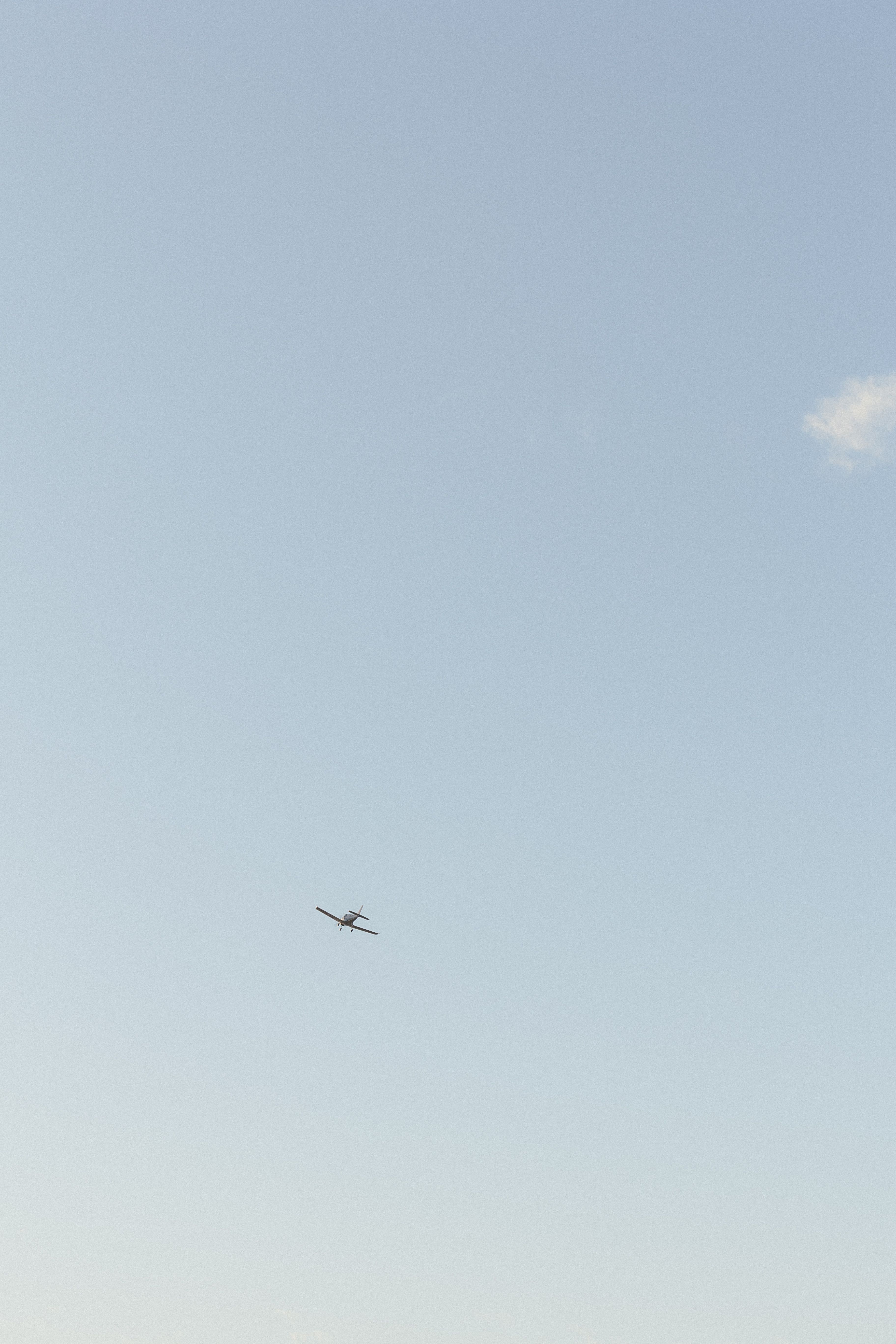Small Airplane Flying in Clear Blue Sky · Free Stock Photo