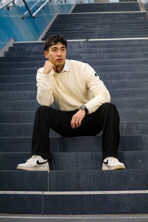 Stylish young man sitting on urban stairs · Free Stock Photo