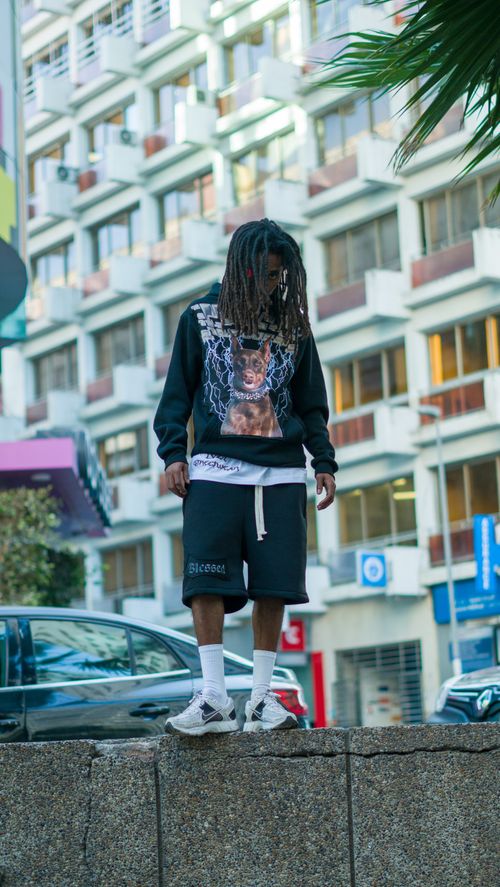 Free A stylish young man in streetwear stands confidently in an urban setting in Morocco. Stock Photo