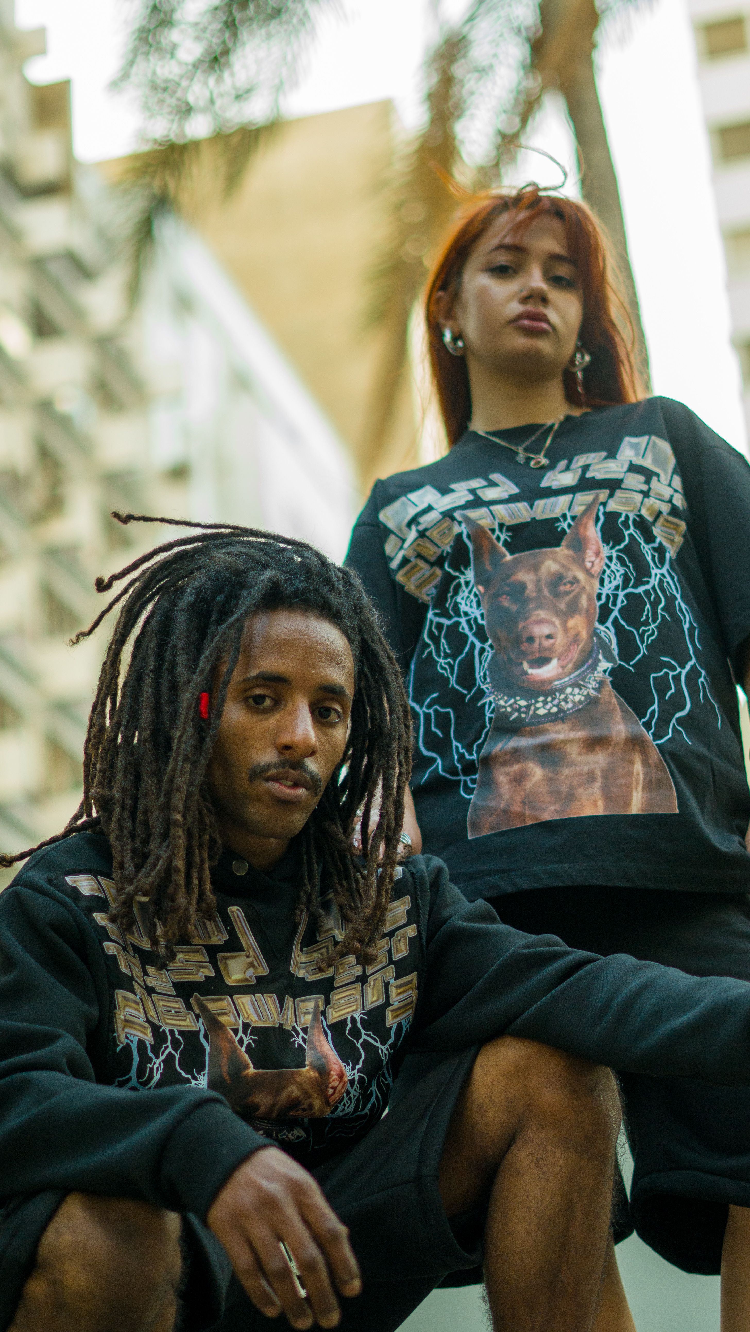 Trendy young adults posing in an urban setting in Morocco, showcasing modern casual fashion.