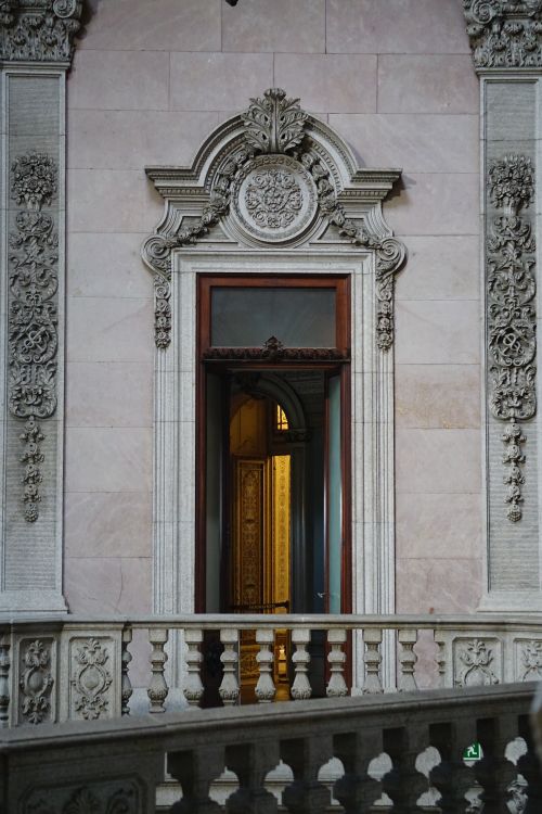 Free Intricately designed vintage door within a classic stone architecture setting. Stock Photo