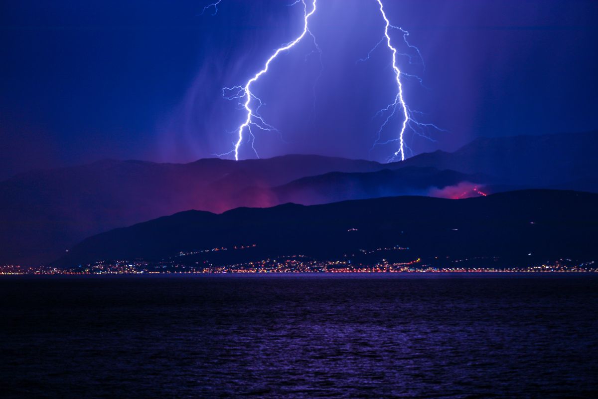 Dramatic Lightning Strike Over Mountain Landscape · Free Stock Photo