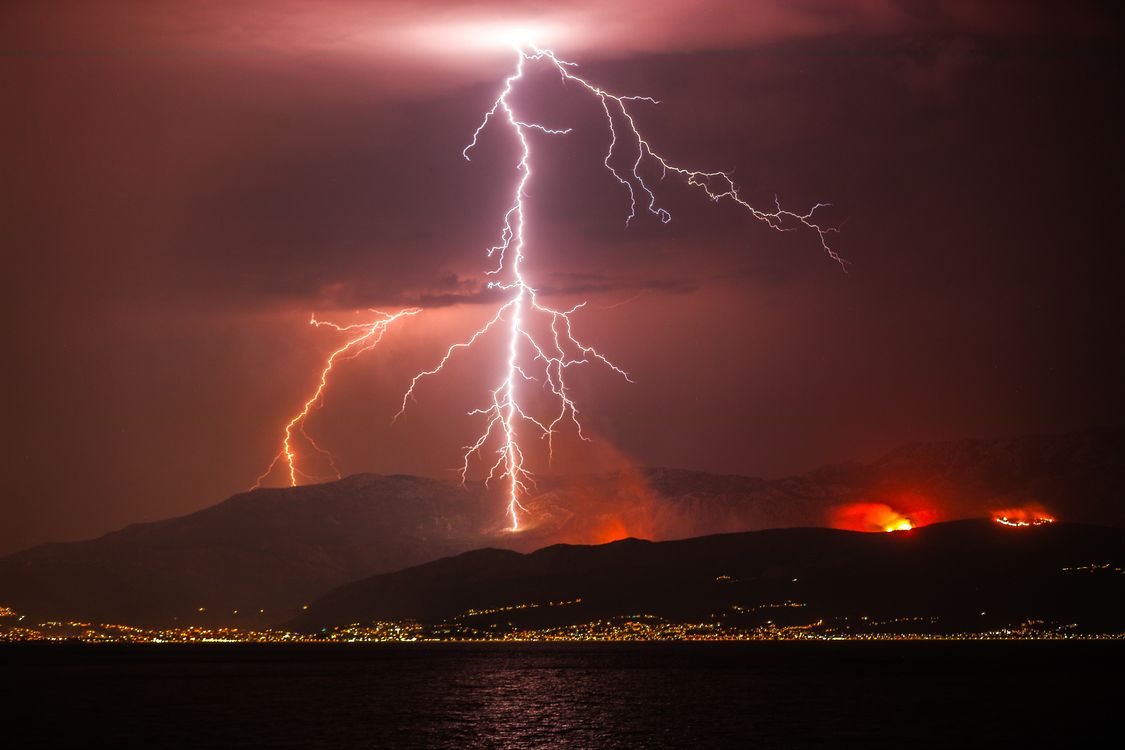 Dramatic Lightning Strike Over Mountain Landscape · Free Stock Photo