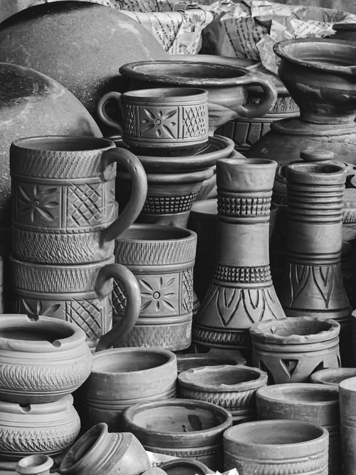 Free A collection of artisanal handmade pottery in a black and white photograph, showcasing intricate craftsmanship. Stock Photo