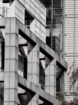 Close-up view of a modern building's geometric facade with a minimalist design and metal finish.