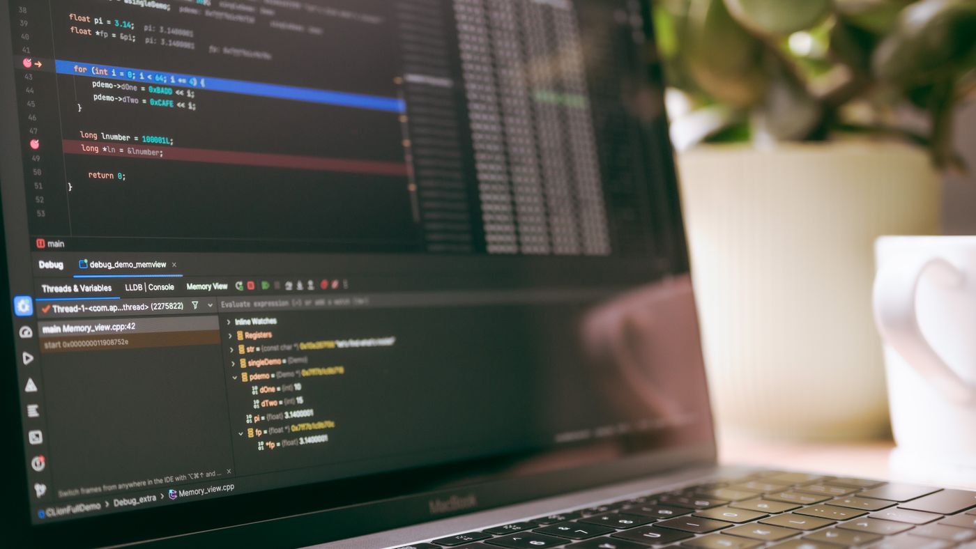 Check what the editor is already telling you before changing settings. Photo: Daniil Komov / Pexels; illustrative, not a VS Code screenshot. Laptop screen showing a code editor with a debugger panel and variables view open
