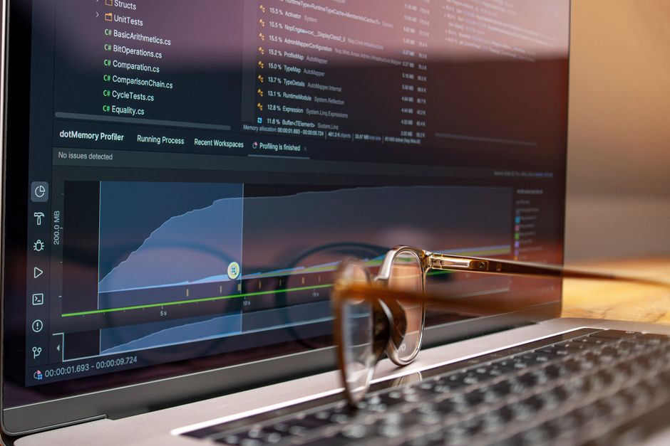 Laptop displaying website performance analytics with glasses resting beside the screen, representing Wix page speed diagnosis