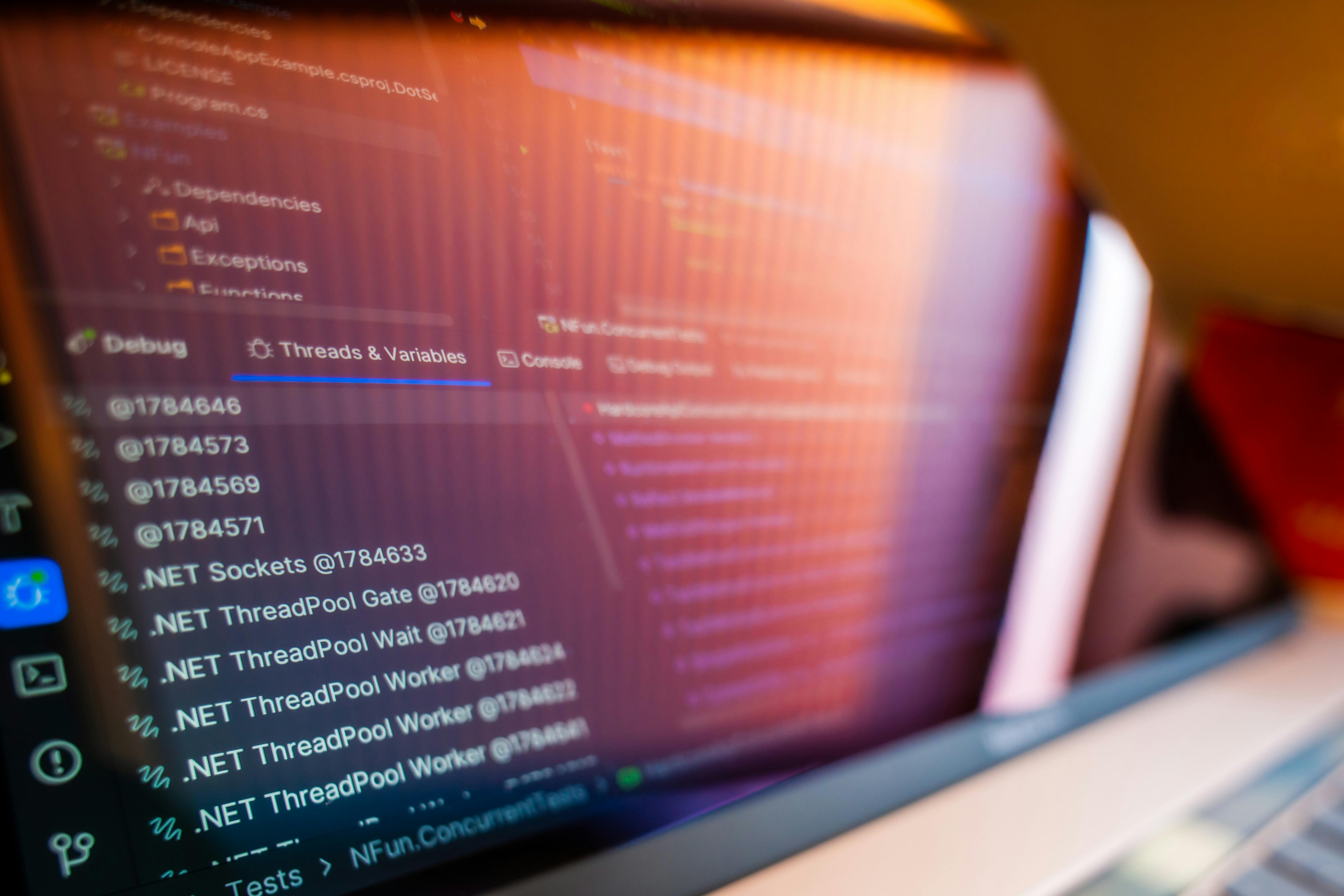 Free Focused view of a computer screen displaying code and debug information. Stock Photo
