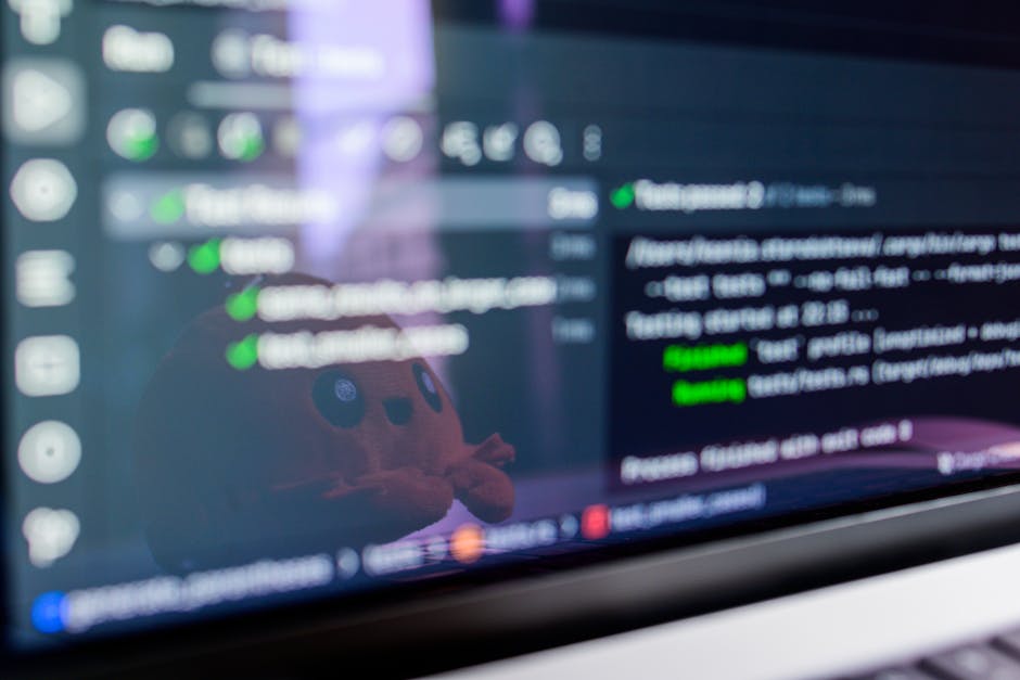 What CertiPUR-US Foam Testing Really Means for Your Mattress Close-up of a laptop screen displaying programming code with a cute plush toy reflecting.