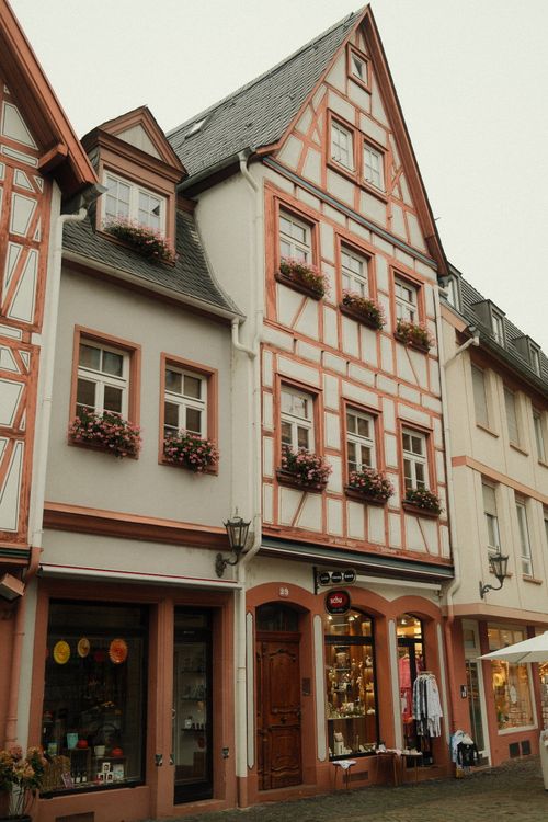 Free Quaint half-timbered buildings line a picturesque street in Mainz, Germany. Stock Photo