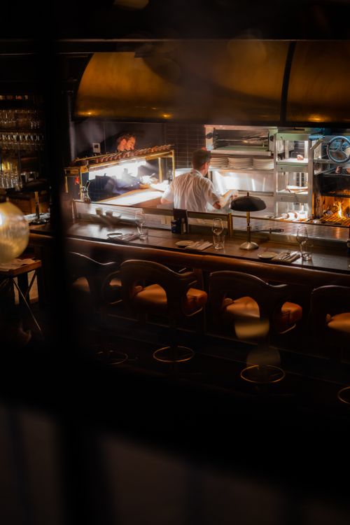 Free Warm and inviting view of a bustling restaurant kitchen in Dublin captured at night. Stock Photo