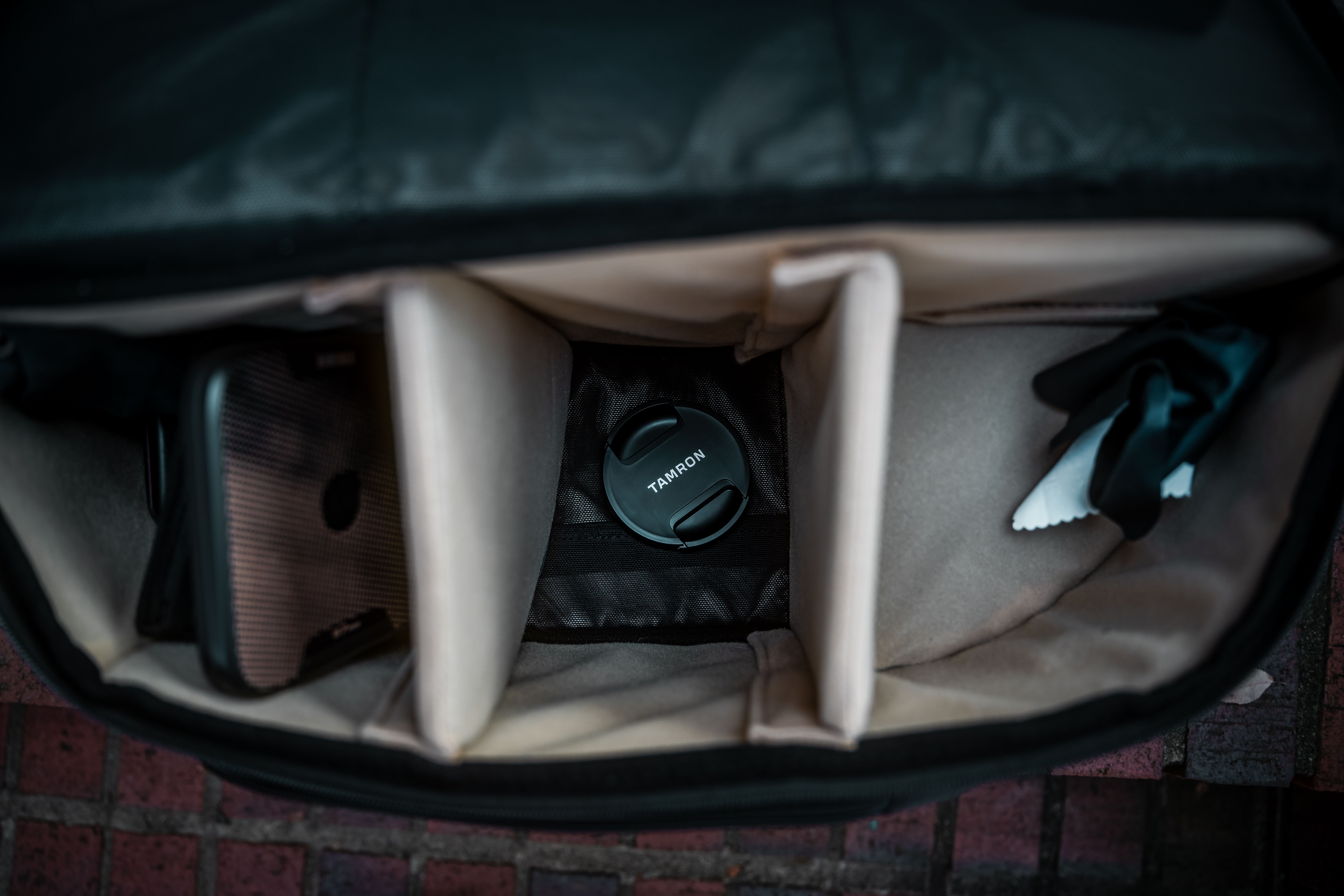Open Camera Bag with Lens Cap and Compartments · Free Stock Photo