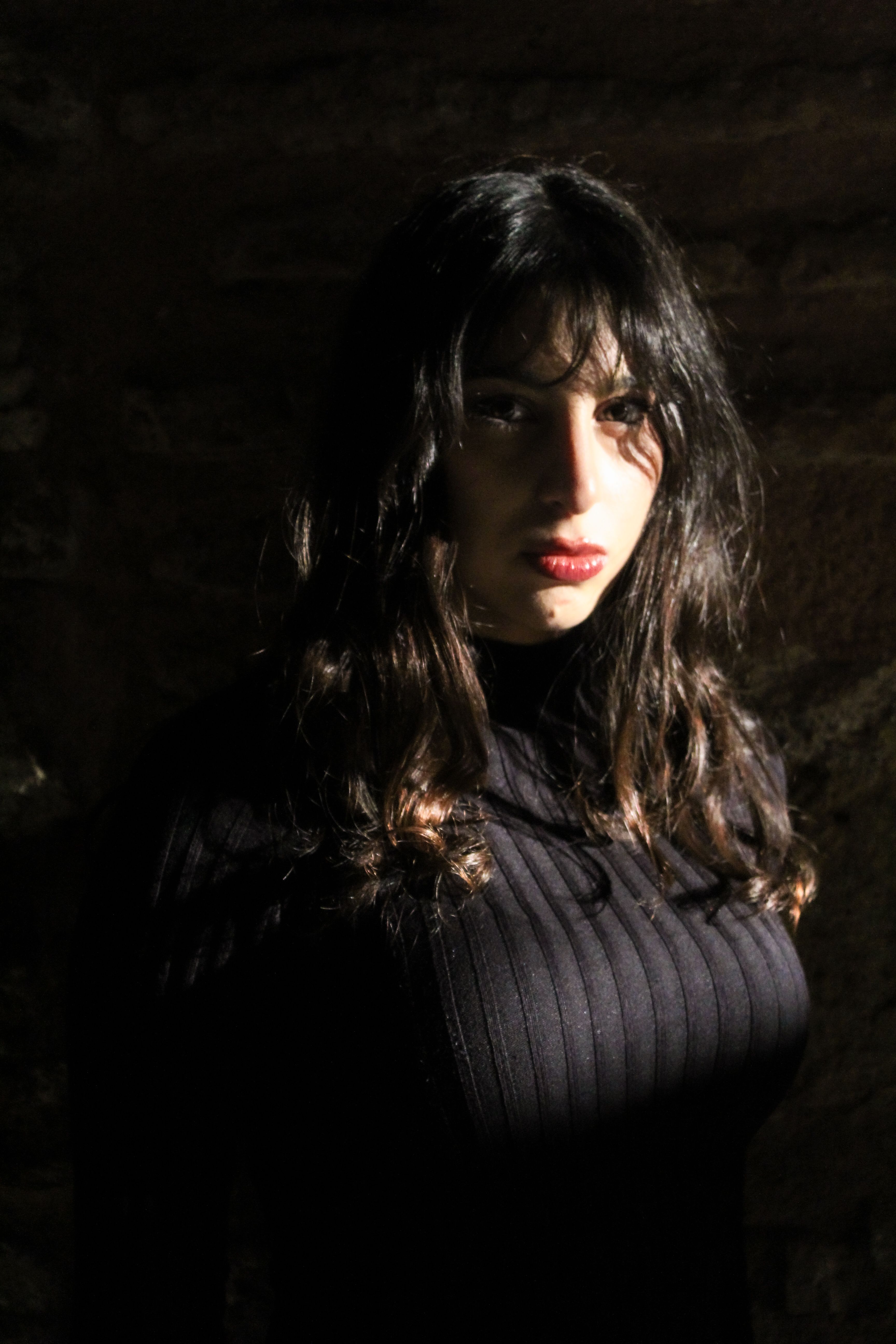 Moody Portrait of Woman in Dramatic Lighting · Free Stock Photo