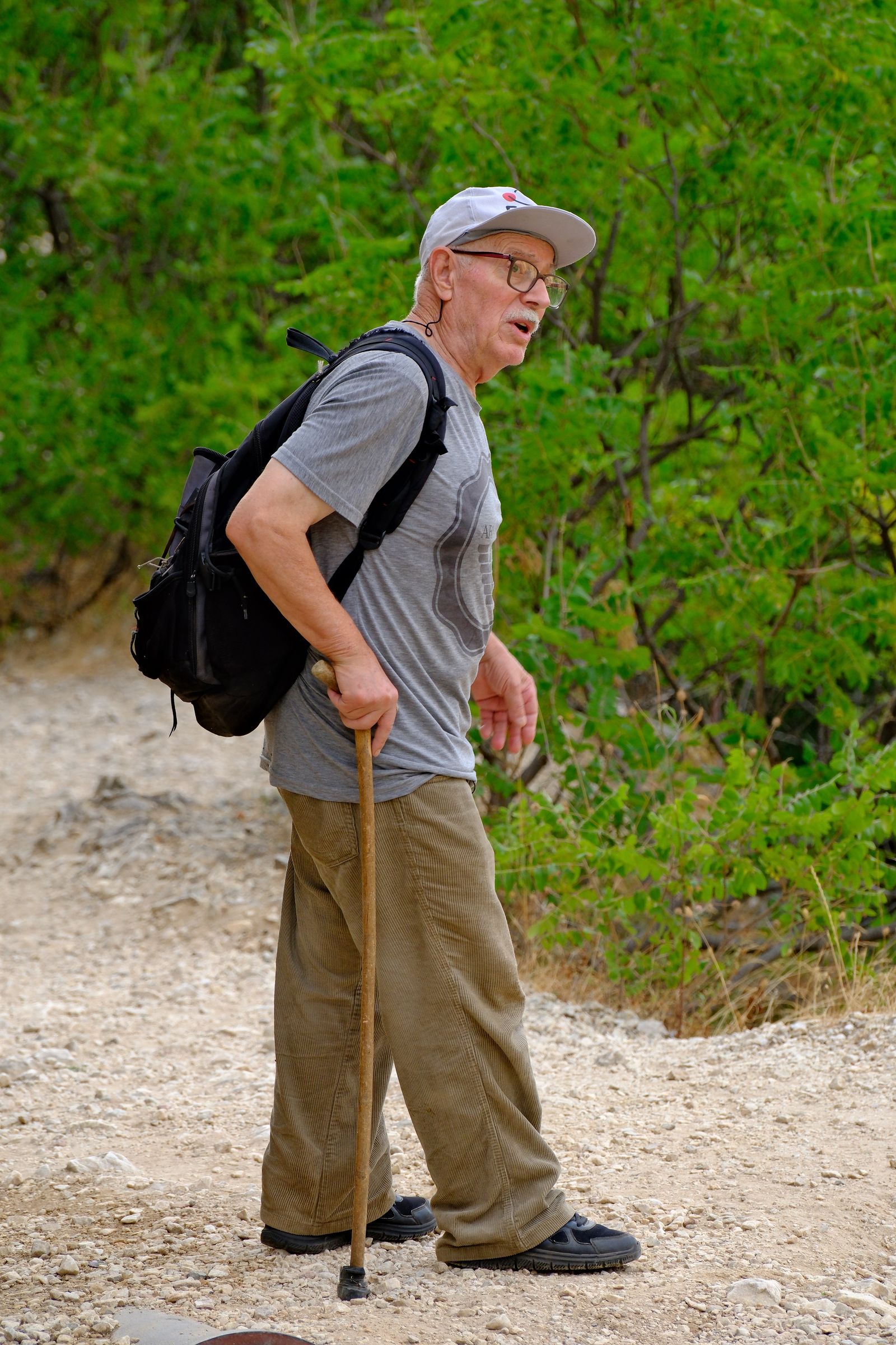 Mature man taking an easy outdoor walk